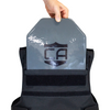 Person holding a gray armor plate showing it being top loaded into backside of patrol vest