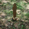 Assembled raw 16" steel popper ground stake target stomped into the ground
