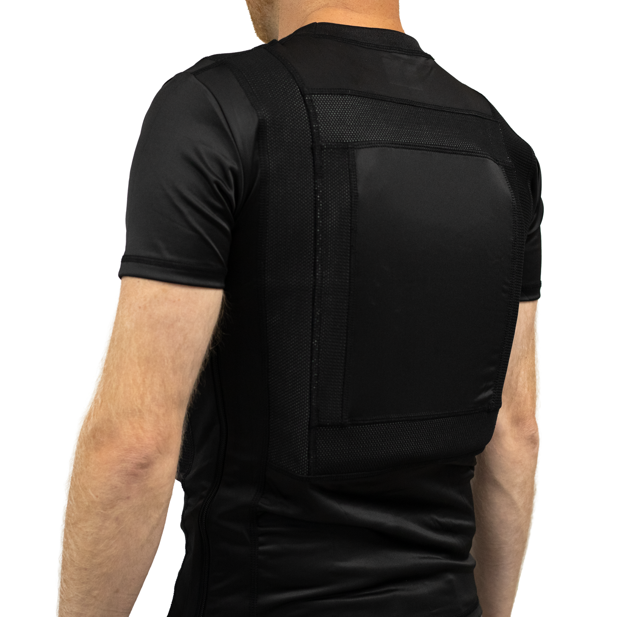 Side view of a black concealable soft body armor t-shirt worn by a man on a white background