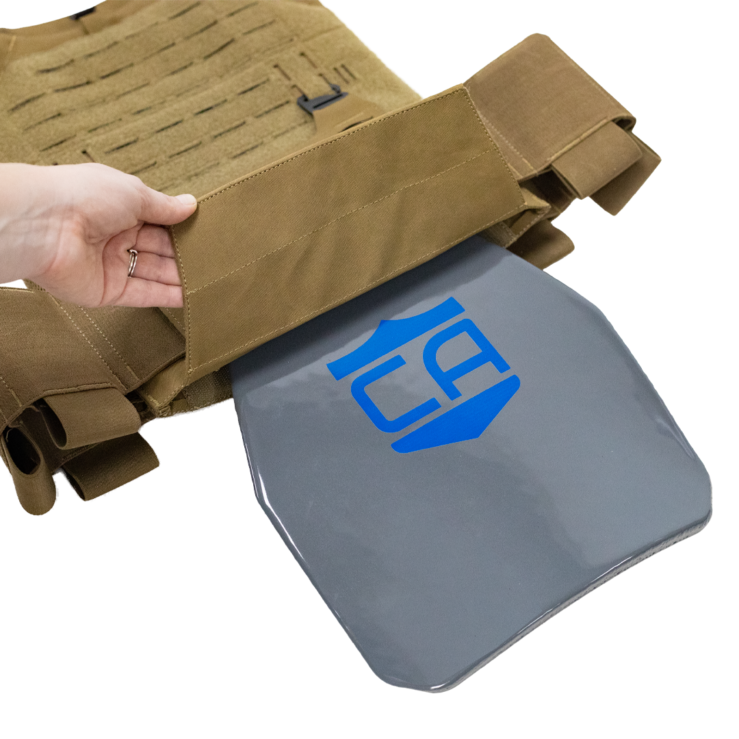 Coyote Tan tactical vest with a gray steel hard armor plate being inserted into the bottom of the plate carrier, plate features a blue CA logo on a white background