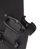 Close-up of backside of a black protective shield with a handle and gun support bracket mounted on a white background