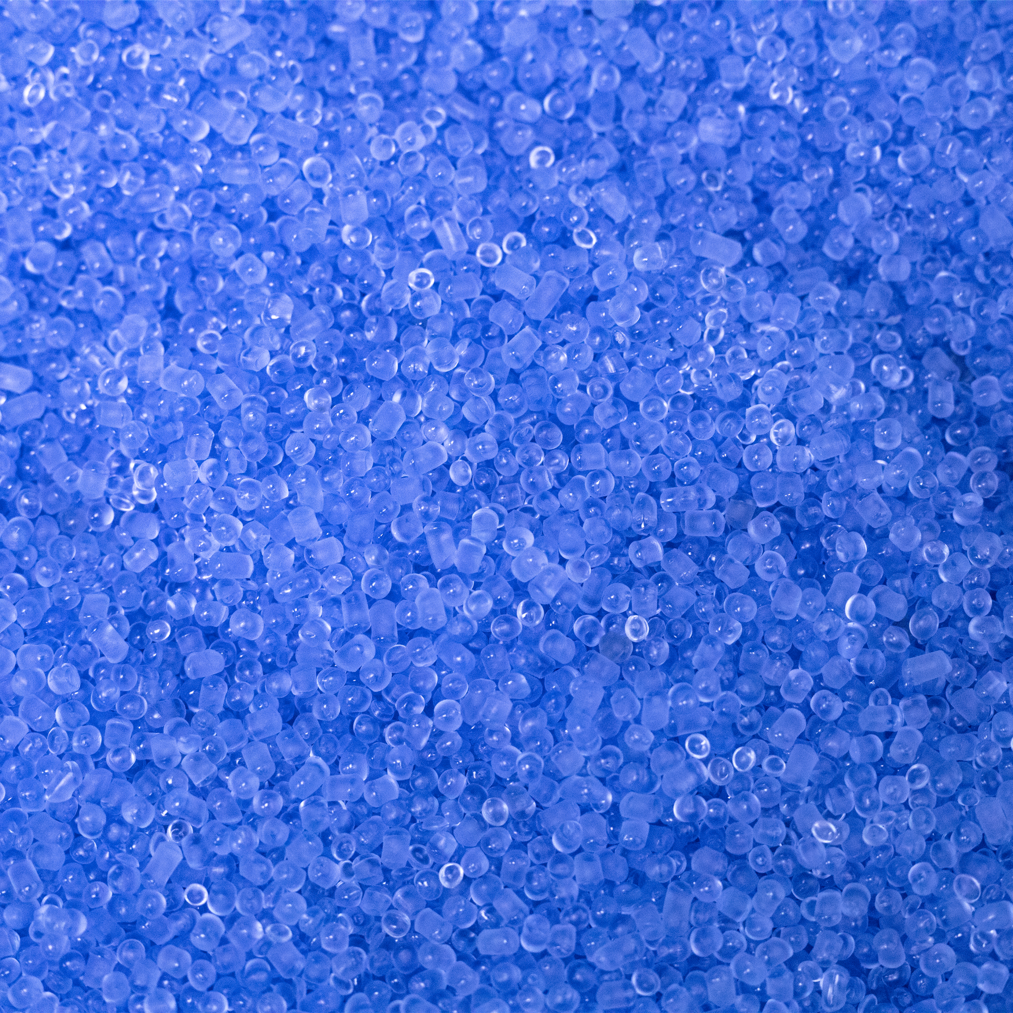 Close-up of blue recycled platic that resembles round pellets used to fill shooting rest bags