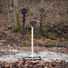 Large 3/8 inch steel dual spinning reactive target at a shooting range