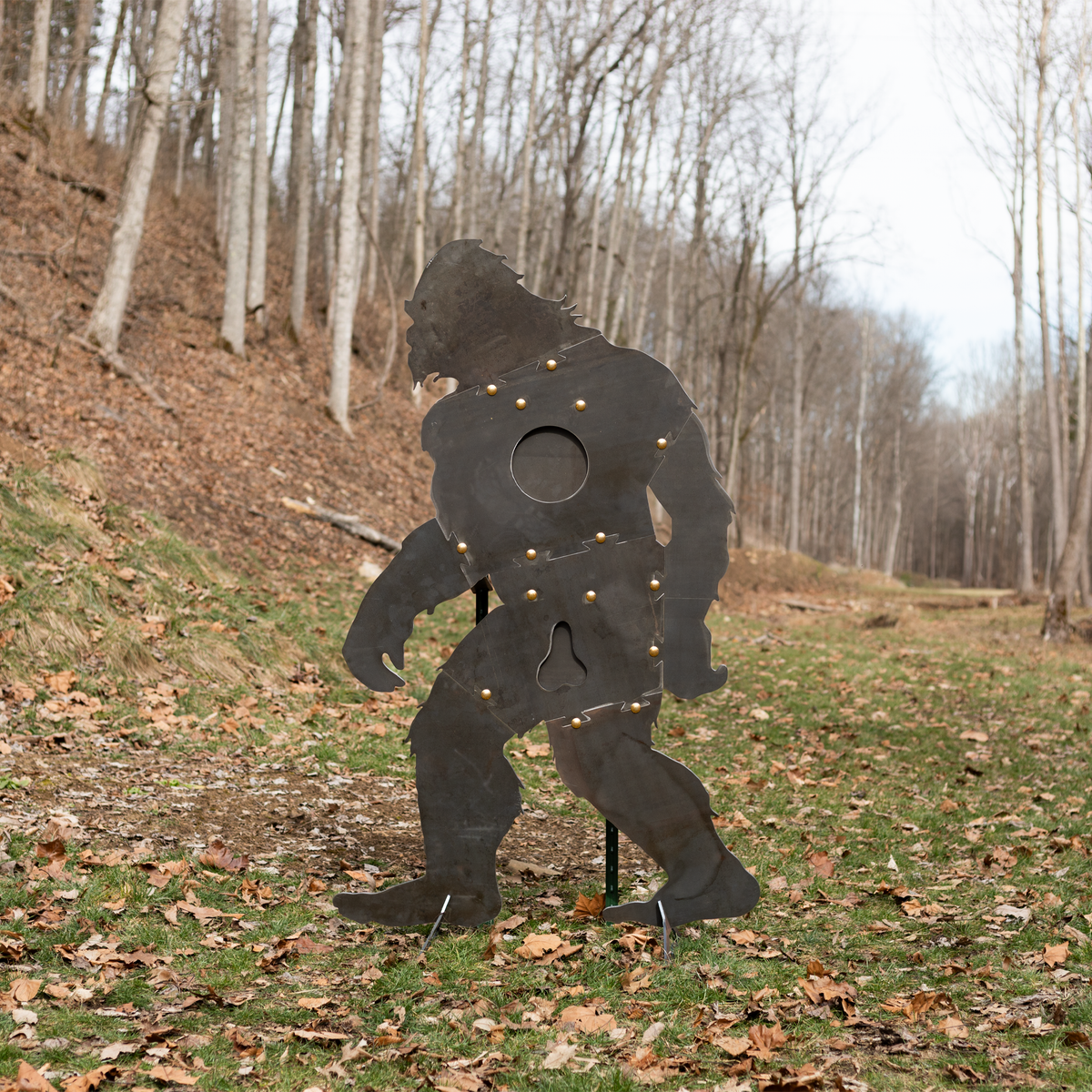 Lifesized sasquach-shaped sr500 steel silhouette target with stand out in the woods