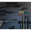 Collection of firearms and ammunition mounted on a black plastic tactical slat wall panel -Assault Wall, organizational storage for guns and tactical gear