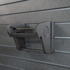 Assault Wall Universal Mag Holder with doublet tap logo with adjustable tension, shown empty mounted to a black Assault Wall panel, highlighting the adjustable slot options that the carbon fiber rod rests in