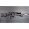 Assault Wall magazine mounted hanger for AR10 rifles, right facing mount with gun hanging from mag well on a black Assault Wall slat wall panel