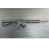 Assault Wall magazine mounted hanger for .22LR-AR15 rifles, Right facing mount with gun hanging from mag well on a black Assault Wall slat wall panel