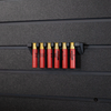 Six red .410 shotgun shells hanging from a black mount that is attached to an Assault Wall tactical slat wall panel