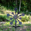 Ten Paddle rotating target- fully armored Texas Star at a wooded shooting range