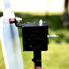 Close-up of acoustic spring system on adjustable T-post target hanger