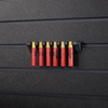 Six red .410 shotgun shells hanging from a black mount that is attached to an Assault Wall tactical slat wall panel