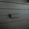 Assault Wall Magnetic mount shown mounted horizontally on a black Assault Wall slat panel, it can be used to hold anything magnetically compatible