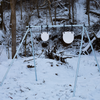double tap industries diy conduit stand kit with powder coated j hooks and painted gong steel targets assembled on an outdoor range in the snow
