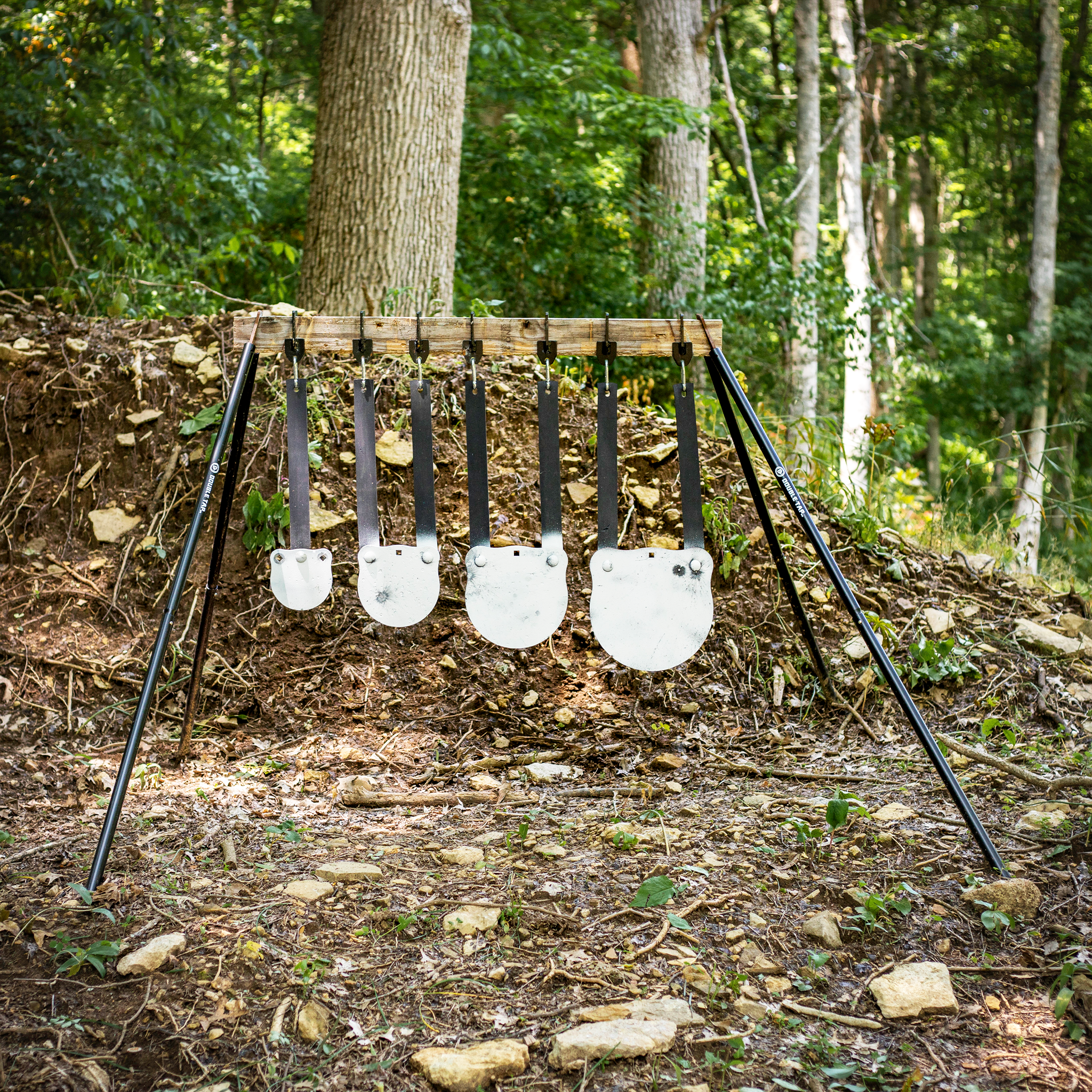 Double tap industries gongs in various sizes hanging from the rubber strap hangers on a conduit stand with a 2x4 mounting system for safer mounting