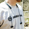 Low-profile electronic headphones used for shooting hearing protection on male model at shooting range