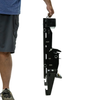 A man holding the assembled black metal fall popper base by it's built in carry handle on a white background