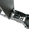 Close-up of a black metal fall popper base with visible bolts, and internal hardware on a white background.