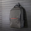 Black single hook mounted to the Assault Wall slat wall panel system  hook is holding a backpack