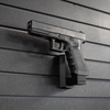 Left facing black plastic magazine mounted 40 Cal pistol hanger installed on Assault Wall Tactical slat wall