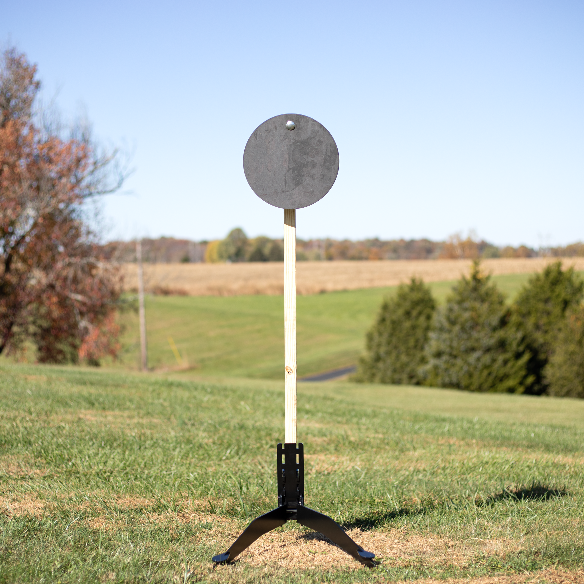 3/8 inch AR500 steel target hanging on range stand example steel challenge competition target at the range