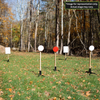 example 2x4 stand with spiked base and hanging round gong targets for durable and adjustable steel challenge competition shooting setup at an outdoor range