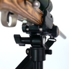 close up of saddle clamp adjustments on stronghold lite aluminum shooting tripod with rifle mounted on a white background
